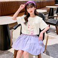 2022夏款韓版中大童花邊領卡通印花上衣+百褶防走光短裙二件套(紫色)
