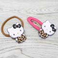 Sanrio 三麗鷗 Hello Kitty 造型髮夾髮飾2入組 (豹紋/曬黑款)_1